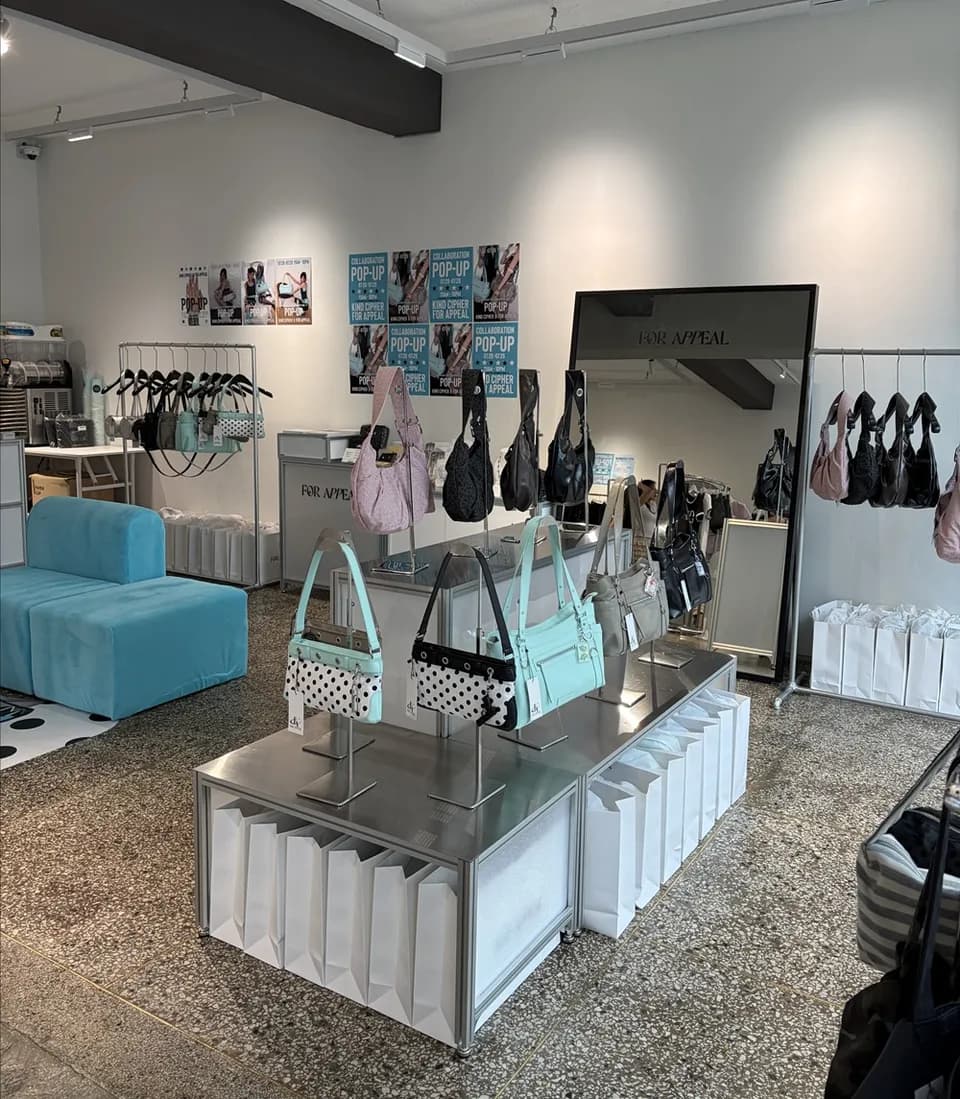 Bright store interior with bags on display