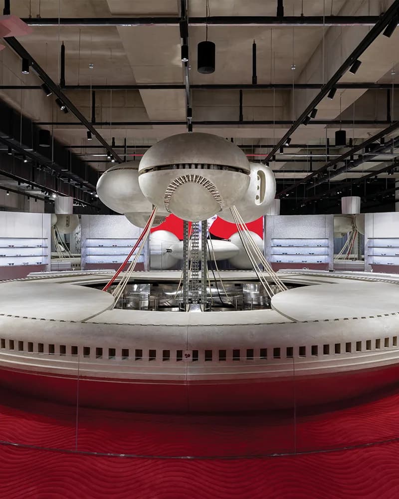 Inside Haus Nowhere Seoul, a round sculpture over a red carpet